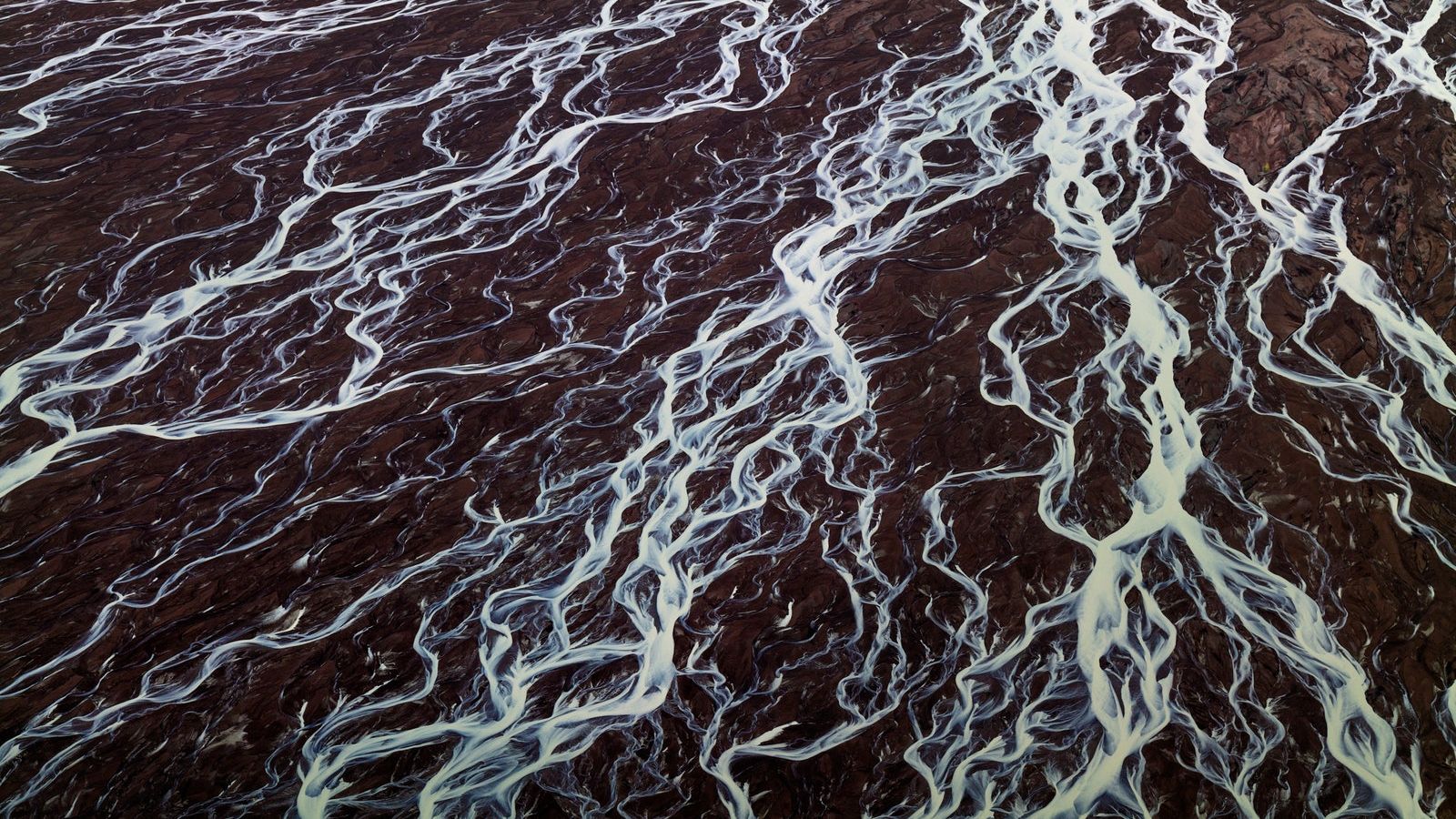 Meltwater streaming from the Russell Glacier eventually makes its way into the North Atlantic. Meltwater streaming from the Russell Glacier eventually makes its way into the North Atlantic.